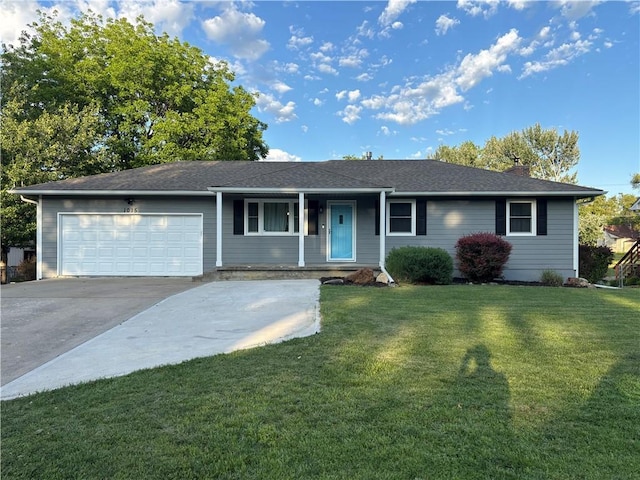 1015 S Elm St, Ottawa, KS 66067 - ranch-style home featuring a garage, a front yard, concrete driveway, a chimney, and a porch