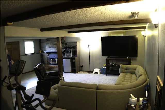 1015 S Elm St, Ottawa, KS 66067 - carpeted living area featuring beam ceiling and a textured ceiling
