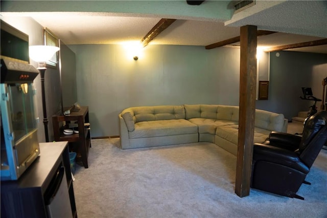 1015 S Elm St, Ottawa, KS 66067 - carpeted living area with beamed ceiling