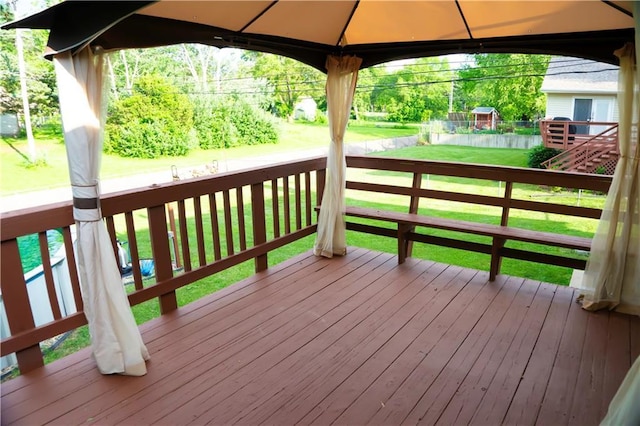 1015 S Elm St, Ottawa, KS 66067 - wooden deck featuring a gazebo and a yard