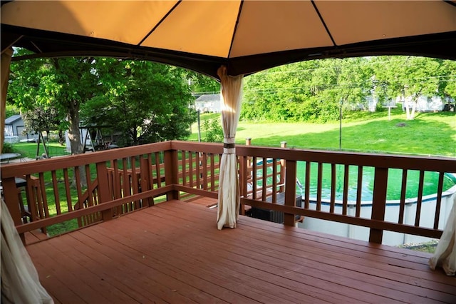 1015 S Elm St, Ottawa, KS 66067 - deck featuring a gazebo and a yard