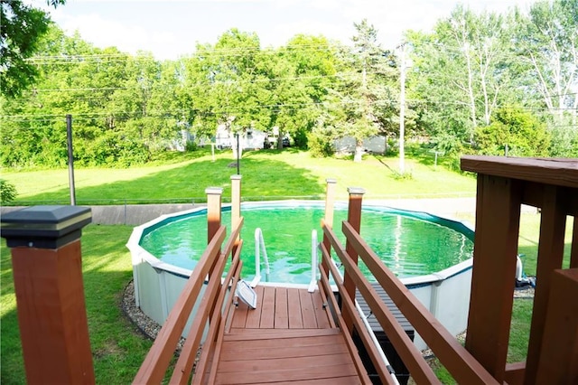 1015 S Elm St, Ottawa, KS 66067 - view of pool with a yard and a view of trees