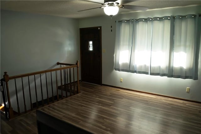 1015 S Elm St, Ottawa, KS 66067 - entrance foyer with baseboards, a ceiling fan, wood finished floors, and a textured ceiling