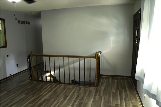 1015 S Elm St, Ottawa, KS 66067 - spare room with wood finished floors, baseboards, and a ceiling fan