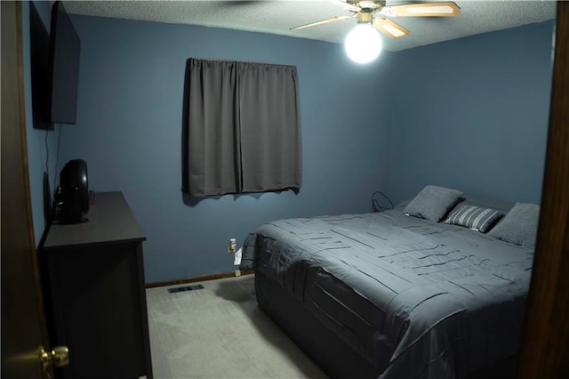 1015 S Elm St, Ottawa, KS 66067 - bedroom featuring carpet, a textured ceiling, baseboards, and ceiling fan