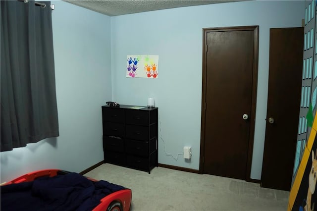 1015 S Elm St, Ottawa, KS 66067 - carpeted bedroom with baseboards