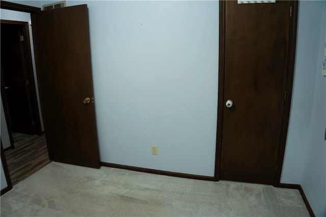 1015 S Elm St, Ottawa, KS 66067 - unfurnished bedroom with carpet and baseboards