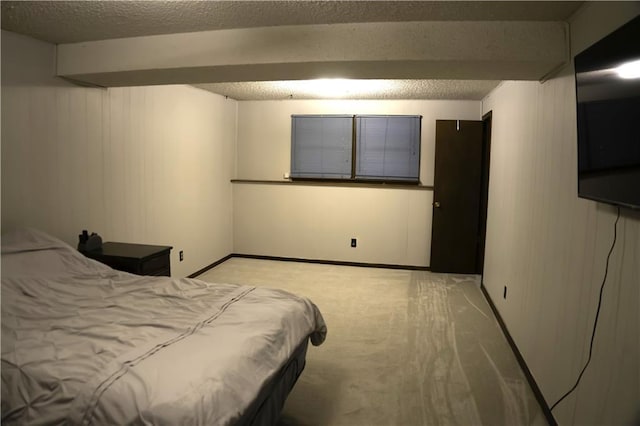 1015 S Elm St, Ottawa, KS 66067 - bedroom featuring light colored carpet and a textured ceiling