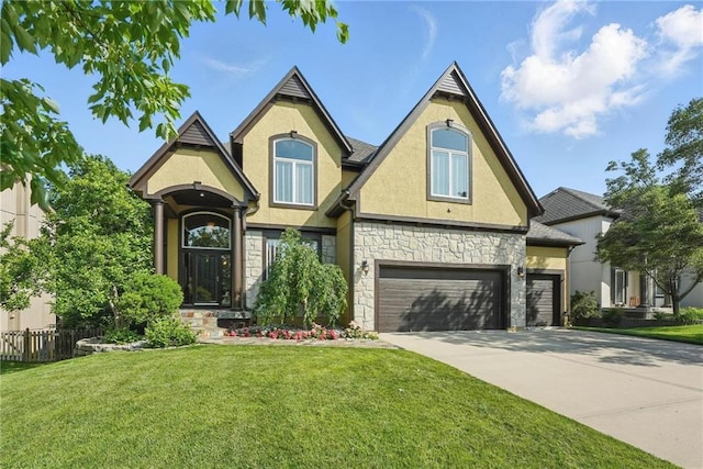 7407 W 145th Ter, Overland Park, KS 66223 - view of front facade featuring stone siding, stucco siding, and driveway