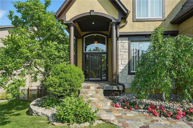7407 W 145th Ter, Overland Park, KS 66223 - property entrance featuring stone siding and stucco siding