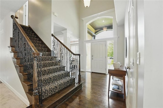 7407 W 145th Ter, Overland Park, KS 66223 - foyer with a towering ceiling, baseboards, stairs, and wood finished floors
