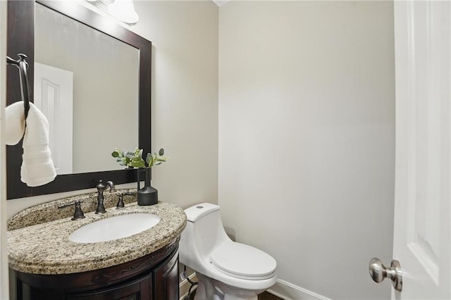7407 W 145th Ter, Overland Park, KS 66223 - bathroom featuring vanity, toilet, and baseboards