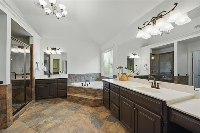 7407 W 145th Ter, Overland Park, KS 66223 - full bathroom featuring a shower stall, vaulted ceiling, two vanities, a bath, and a chandelier