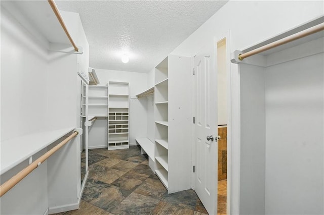 7407 W 145th Ter, Overland Park, KS 66223 - walk in closet with stone finish floors