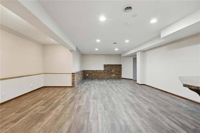7407 W 145th Ter, Overland Park, KS 66223 - unfurnished living room with wood finished floors, recessed lighting, and baseboards