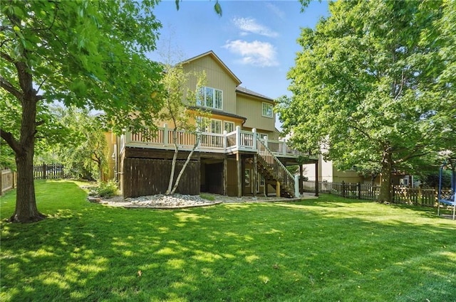 7407 W 145th Ter, Overland Park, KS 66223 - rear view of property with stairway, a deck, and a trampoline