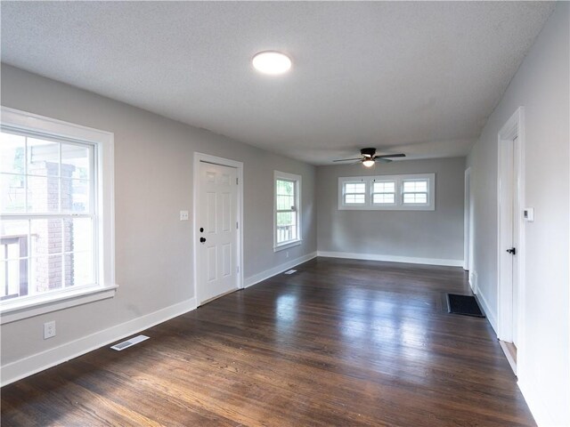 4941 Park Ave, Kansas City, MO 64130 - entrance foyer featuring dark wood-style flooring, ceiling fan, and baseboards