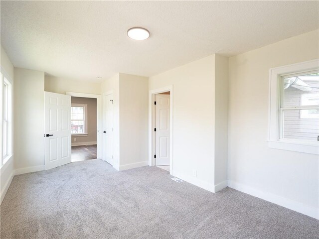 4941 Park Ave, Kansas City, MO 64130 - unfurnished room with carpet floors and baseboards