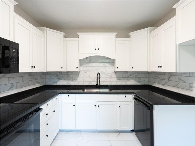 4941 Park Ave, Kansas City, MO 64130 - kitchen with a sink, black appliances, tasteful backsplash, and light marble finish flooring