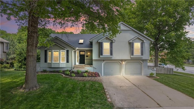 1728 SE 7th Ter, Lees Summit, MO 64063 - tri-level home with concrete driveway, a lawn, an attached garage, and brick siding