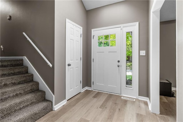 1728 SE 7th Ter, Lees Summit, MO 64063 - entrance foyer with light wood-style flooring, stairs, and baseboards