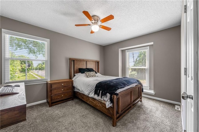 1728 SE 7th Ter, Lees Summit, MO 64063 - carpeted bedroom with baseboards, a textured ceiling, and a ceiling fan