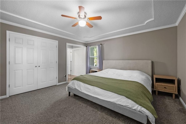 1728 SE 7th Ter, Lees Summit, MO 64063 - bedroom with carpet flooring, a textured ceiling, crown molding, baseboards, and two closets