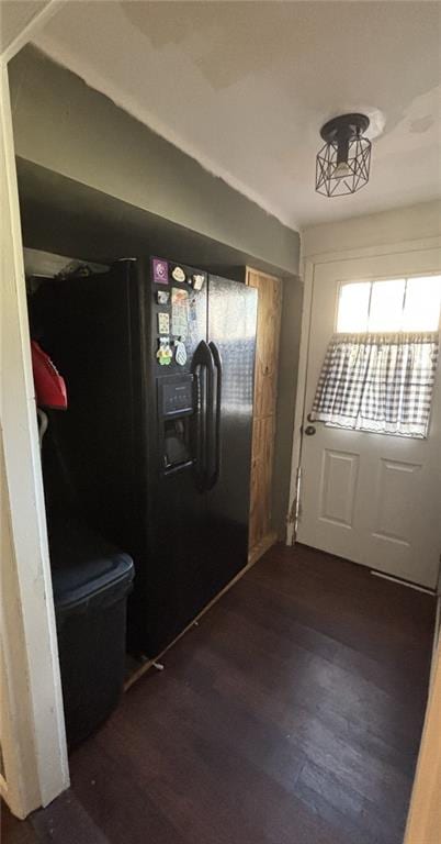 611 W Main St, Chanute, KS 66720 - doorway to outside with dark wood-style flooring