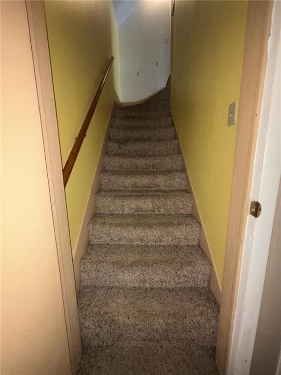 611 W Main St, Chanute, KS 66720 - stairs featuring carpet
