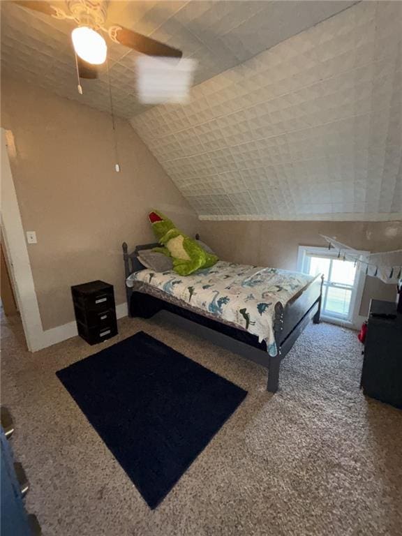 611 W Main St, Chanute, KS 66720 - bedroom featuring carpet floors, vaulted ceiling, and a ceiling fan