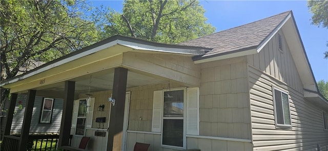 1003 W 3rd St, Pittsburg, KS 66762 - view of property exterior featuring a shingled roof and covered porch