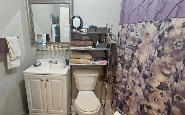 1003 W 3rd St, Pittsburg, KS 66762 - bathroom featuring toilet, vanity, curtained shower, and tile patterned floors