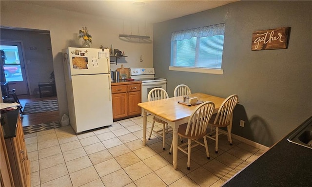 1003 W 3rd St, Pittsburg, KS 66762 - dining space with light tile patterned flooring