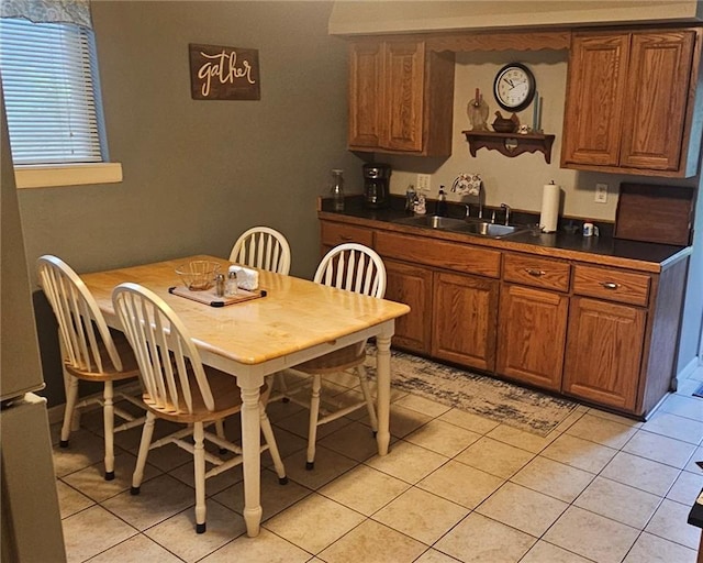 1003 W 3rd St, Pittsburg, KS 66762 - dining area featuring light tile patterned floors