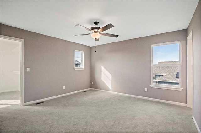 12513 S White Ash Ln, Lees Summit, MO 64086 - spare room featuring carpet, ceiling fan, and baseboards
