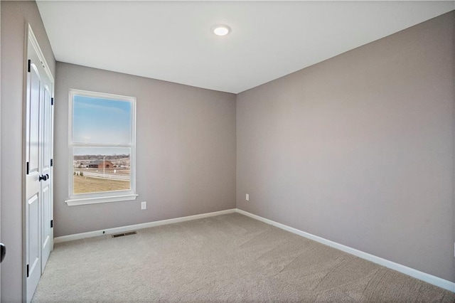 12513 S White Ash Ln, Lees Summit, MO 64086 - carpeted spare room featuring baseboards