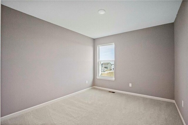 12513 S White Ash Ln, Lees Summit, MO 64086 - carpeted empty room with baseboards