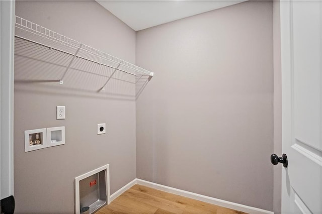 12513 S White Ash Ln, Lees Summit, MO 64086 - laundry room featuring electric dryer hookup, washer hookup, light wood-type flooring, and baseboards