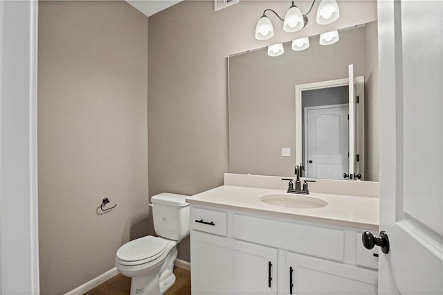 12513 S White Ash Ln, Lees Summit, MO 64086 - bathroom featuring vanity, toilet, and baseboards