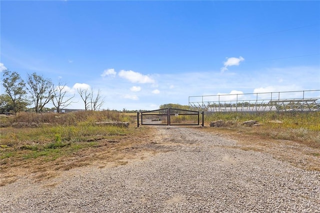 411 E 203rd St, Belton, MO 64012 - view of road with a gate and a view of rural / pastoral area