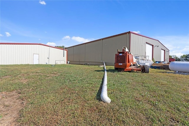 411 E 203rd St, Belton, MO 64012 - view of grassy yard featuring an outbuilding and an outdoor structure