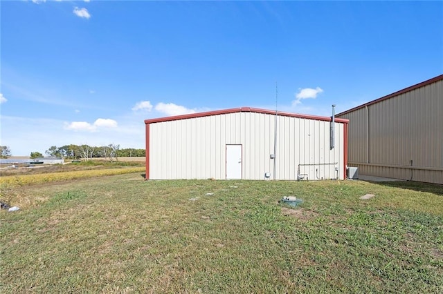 411 E 203rd St, Belton, MO 64012 - view of pole building with a yard