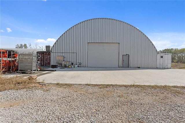 411 E 203rd St, Belton, MO 64012 - view of outdoor structure featuring concrete driveway