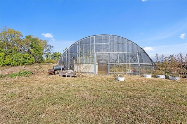411 E 203rd St, Belton, MO 64012 - view of greenhouse featuring a yard
