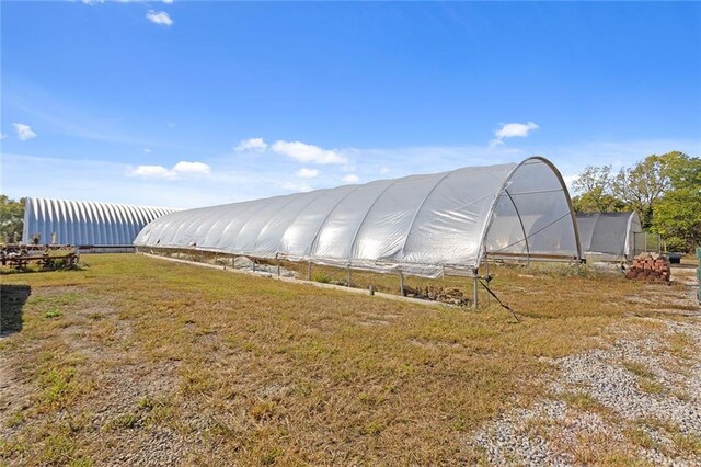 411 E 203rd St, Belton, MO 64012 - view of greenhouse with a yard