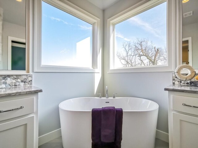 3248 W 133rd Ter, Leawood, KS 66209 - bathroom with vanity and a soaking tub