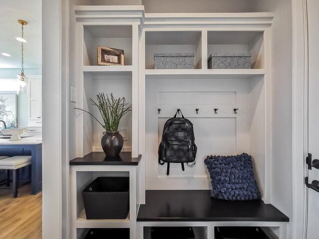 3248 W 133rd Ter, Leawood, KS 66209 - mudroom with built in shelves and wood finished floors