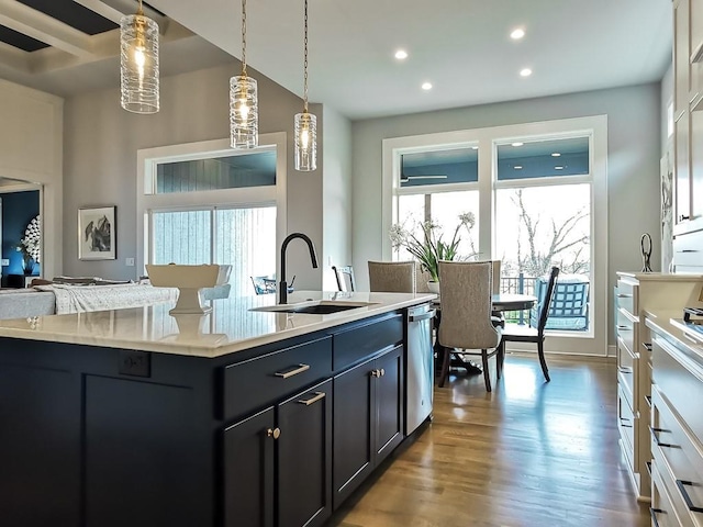 3248 W 133rd Ter, Leawood, KS 66209 - kitchen with stainless steel dishwasher, wood finished floors, dark cabinets, recessed lighting, and hanging light fixtures