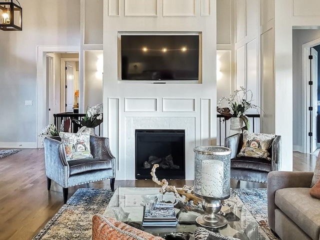 3248 W 133rd Ter, Leawood, KS 66209 - living room with wood finished floors, a fireplace, and a high ceiling