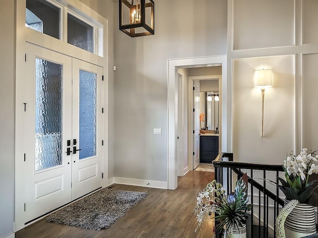 3248 W 133rd Ter, Leawood, KS 66209 - entryway featuring french doors, dark wood-style floors, and a towering ceiling